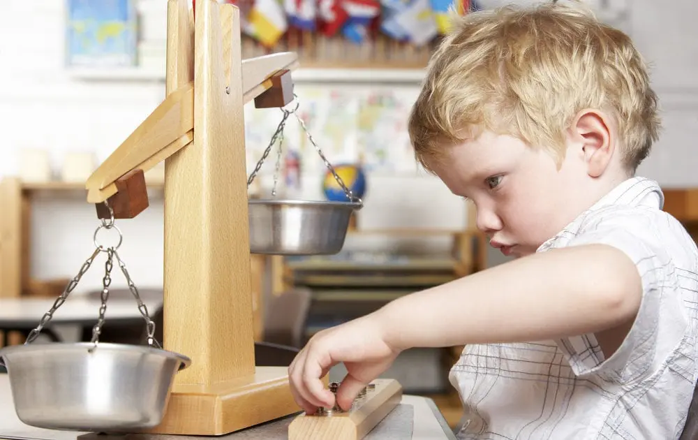 Montessori practical life area where children learn to care for their environment by watering plants.