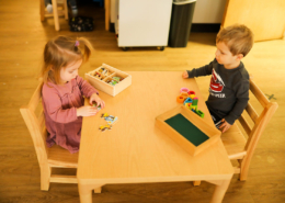 A student using Montessori number rods to understand counting and measurement.